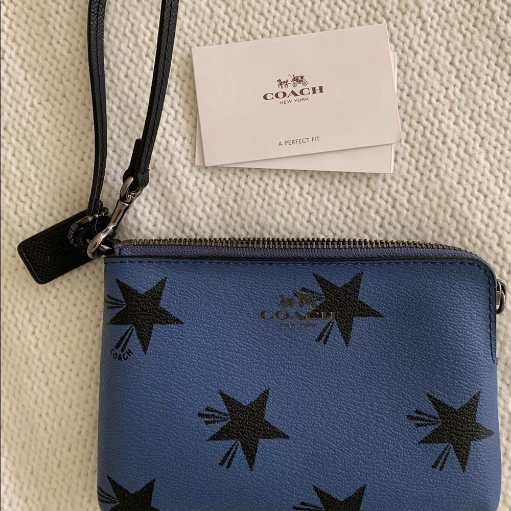 Star printed Coach wristlet.